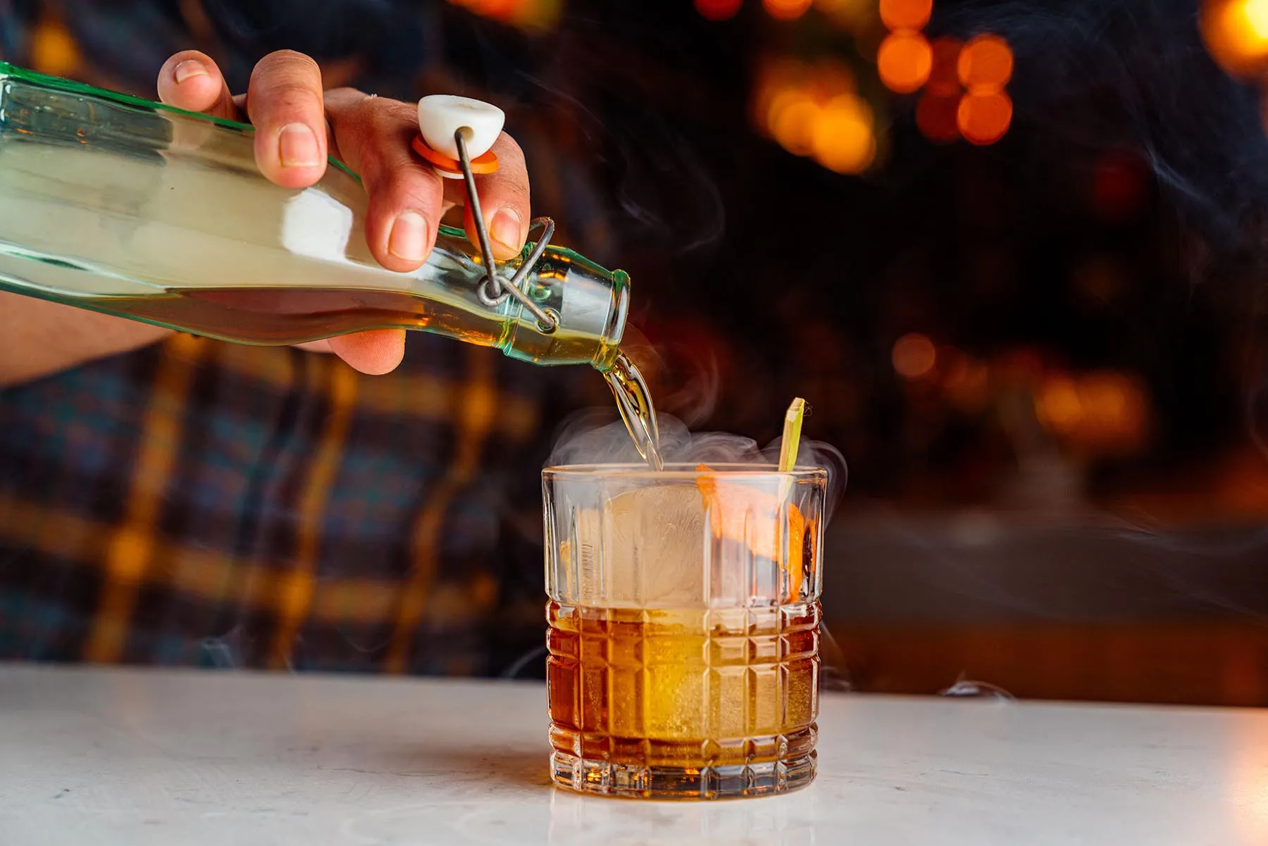 bartender pouring a drink